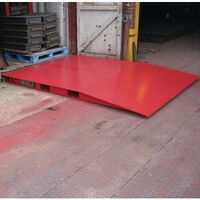 Ground level container access ramp