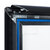 Regenwasserfester Kundenstopper / Plakatständer WindSign „Seal”, 44mm-Profil | fekete sarokillesztés, fekete műanyag sarokkal a csúcson DIN A0 (841 x