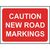Caution new road markings temporary road sign