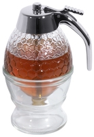 Honigspender aus Pressglas mit verchromter Kappe, mit Abstellgefäß Volumen: 0,2